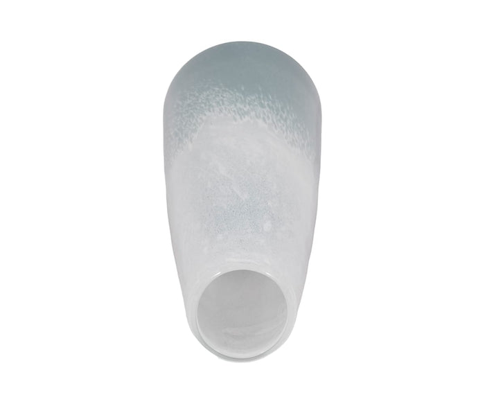The Polar Frost Vase, featuring a white and light blue ombré ceramic finish, rests on its side against a plain white background.