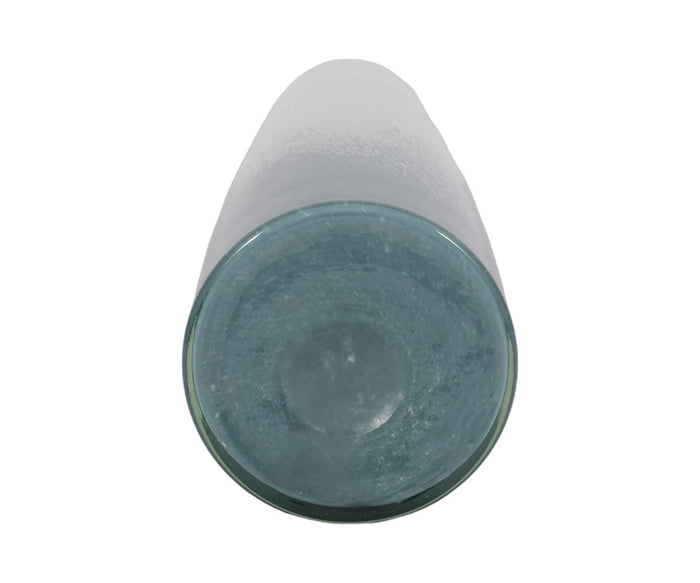 The Polar Frost Vase, featuring a transparent, cylindrical design, is shown from the bottom against a white background; its circular glass base displays a textured pattern and a gentle blue-green ombré tint.