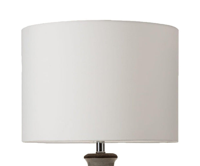 A close-up of a white fabric lamp shade with a simple, modern design, set against a plain white background. The partially visible base at the bottom belongs to the Polished Terracotta Lamp in warm grey.
