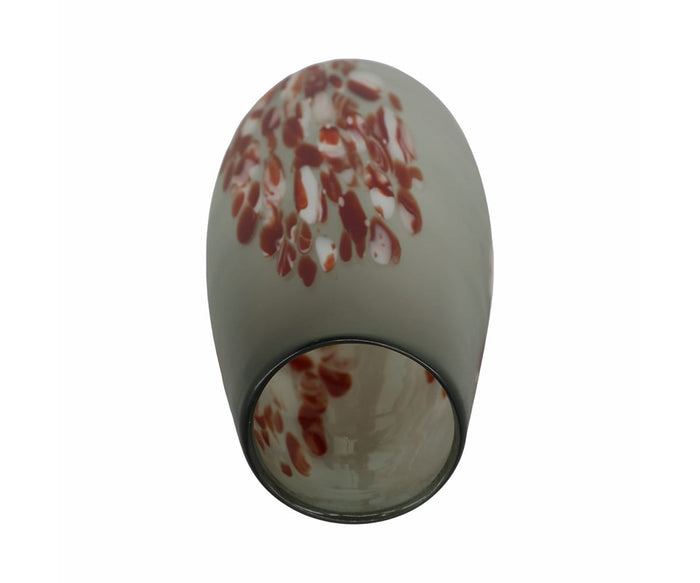 The Poppy Frost Vase, featuring a tall silhouette and a matte gray finish accented by red and white speckled patterns near the top, is displayed from a tilted angle with its opening facing forward. This elegant, hand-finished glass vase adds subtle floral charm to any décor.