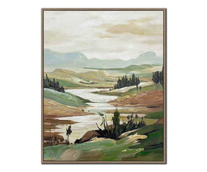 A serene landscape painting depicting green hills, a gently flowing river, scattered trees, and distant blue mountains beneath a cloudy sky; the Quiet Current I & II Wall Art Set is presented on hand-embellished canvases and elegantly set in oak floating frames to enhance their tranquil beauty.