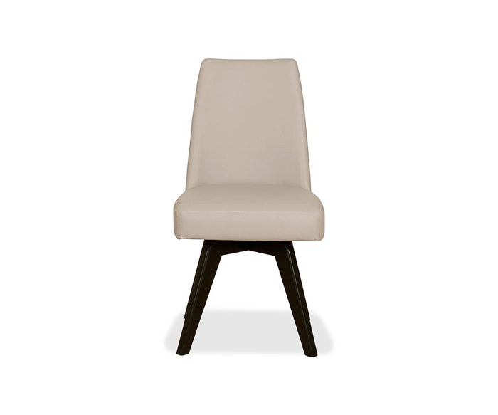 A front view of the Raynor Leather Swivel Dining Chair in Raynor Taupe, featuring a modern gently angled backrest and dark beech legs, isolated on a white background.