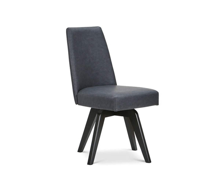 The Raynor Swivel Dining Chair is a modern upholstered dining chair with a dark, padded seat and backrest, featuring black angled wooden legs and shown against a white background.