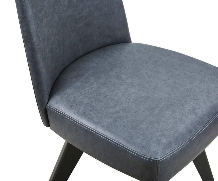 Close-up of the Raynor Swivel Dining Chair, showcasing its modern upholstered design with a dark gray seat and backrest in smooth, slightly textured fabric, complemented by black wooden legs. This chair effortlessly blends comfort and contemporary style, making it an ideal addition to any dining area.
