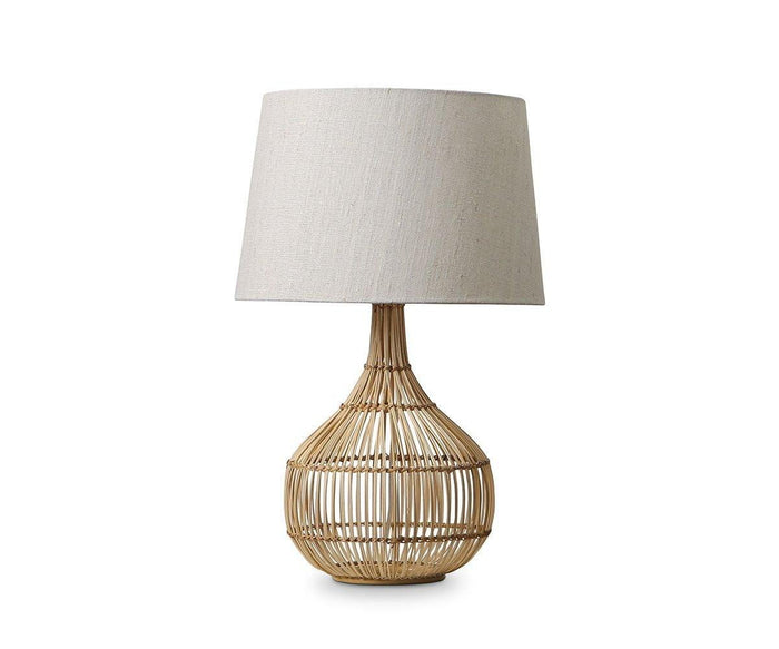 The Reilu Table Lamp features a natural wicker woven rattan base and a beige fabric lampshade, set against a plain white background—perfect for adding effortless boho chic decor to your space.