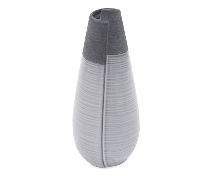 Introducing the Rolled Two Tone Vase: a tall, modern ceramic vase in grey featuring a sleek body with horizontal textured lines and a matte finish. Its design is completed with a dark gray top section and a narrow, angled opening.