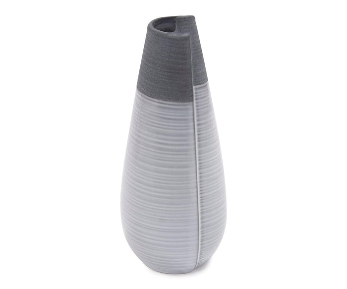 The Rolled Two Tone Vase features a tall, modern design with a matte gray top and a light gray, horizontally ribbed body, finished with a narrow opening—this elegant vase brings contemporary style to any space.