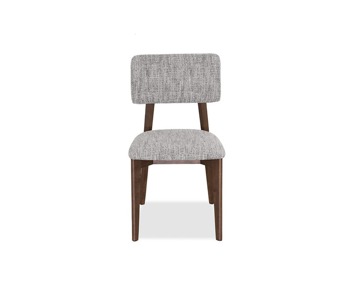 Introducing the Saga Dining Chair, a stylish mid-century piece with a gray upholstered seat and backrest, set on dark walnut wooden legs and frame. Shown against a plain white background, this modern chair blends comfort and sophistication, making it the perfect addition to any contemporary dining space.