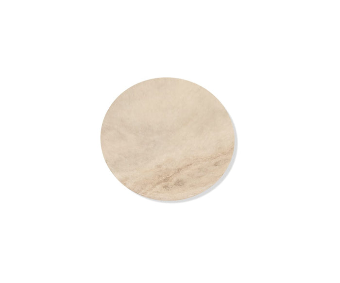 A single round piece of light brown parchment paper, shown on a white background, perfectly complements Savina Round Marble Coasters - 4 Piece—distinctive marble coasters crafted to bring an elegant and artisanal accent to any space.