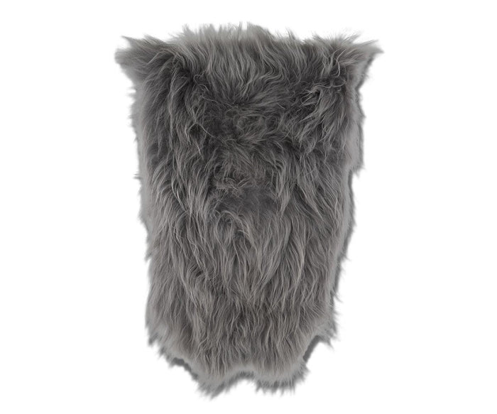 A rectangular piece of Sheepskin Throw in Sheepskin Grey, featuring fluffy long-haired faux fur reminiscent of a Scandinavian rug, photographed on a white background.