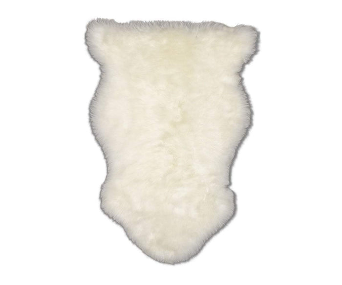 The Sheepskin Throw – Ivory features an oval shape and a fluffy, fuzzy texture crafted from premium New Zealand wool in Sheepskin Ivory. Shown against a plain white background, this Scandinavian essential adds cozy warmth and timeless style to any space.