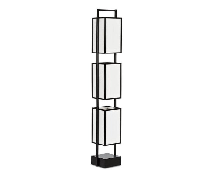 Introducing the Shizuka Wooden Floor Lamp in black—a modern floor lamp featuring a sleek black metal frame with three stacked rectangular white lampshades, each separated by open space and reminiscent of an elegant lantern design. The lamp stands on a sturdy black square base.