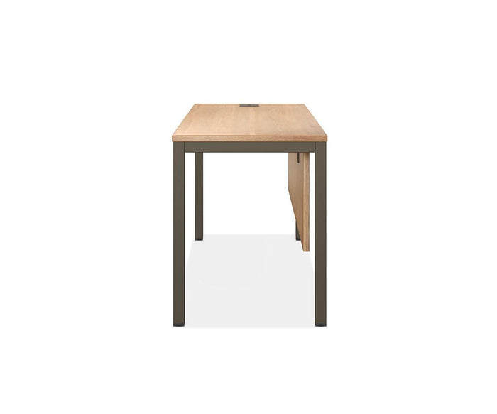 The Slater 63″ Desk is a contemporary piece featuring a rich wood grain veneer surface and sturdy black metal legs. Seen from the front, it includes a rectangular cutout on the desktop designed for convenient cable management.