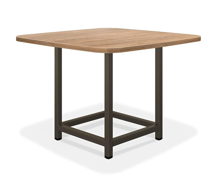 The Slater Square Meeting Table features a square wooden top with rounded corners and a sturdy black metal frame base, photographed against a white background. Ideal for modern office environments.