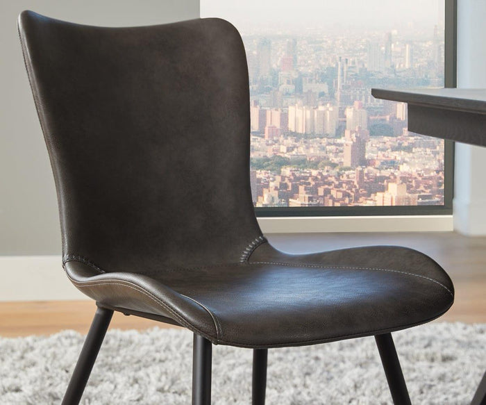 The Steele Dining Chair, featuring a modern dark brown finish and a curved backrest in mid-century style, sits on a light gray rug near a window overlooking a cityscape.