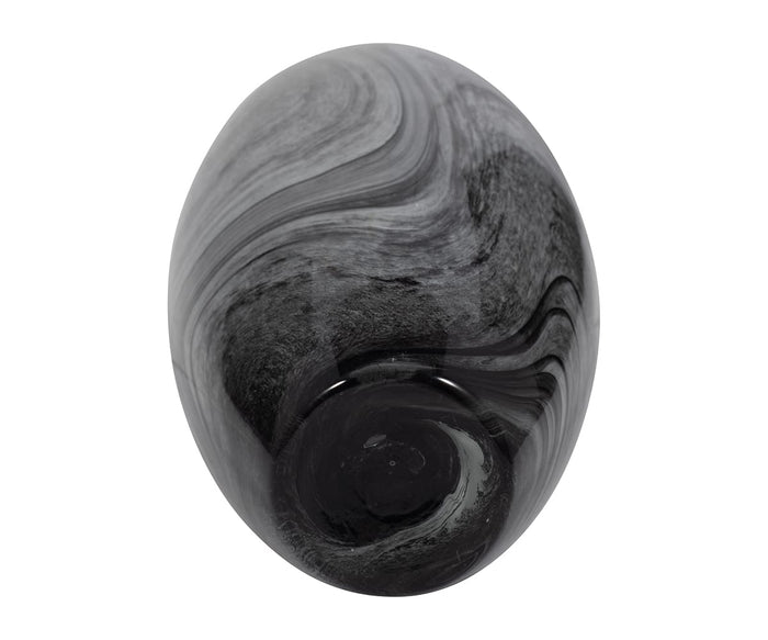 A hand-finished, oval-shaped Stormy Swirl Vase crafted from polished black glass, featuring swirling gray and white patterns, displayed against a plain white background.