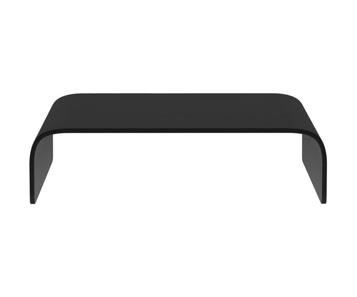 The Stressless® Stella Ottoman Table in black showcases a minimalist, rectangular design with rounded edges and an open space beneath, complemented by a sleek modern finish and displayed against a white background.