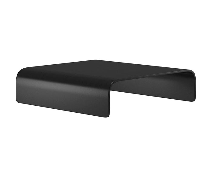 The Stressless® Stella Ottoman Table is a black, minimalist, rectangular stand with rounded edges and an open space beneath, designed to elevate your computer monitor or laptop. With its modern finish reminiscent of a sleek ottoman tray, it effortlessly complements contemporary workspaces.