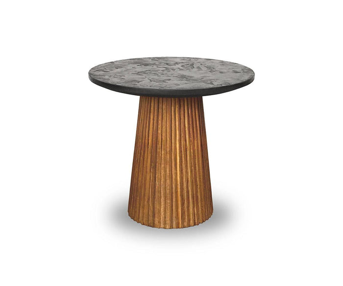 A round Taavi 20″ End Table in natural teak, featuring a textured top and a tapered, ribbed wooden base crafted from reclaimed teak, shown on a white background—a perfect accent for any mid-century modern space.