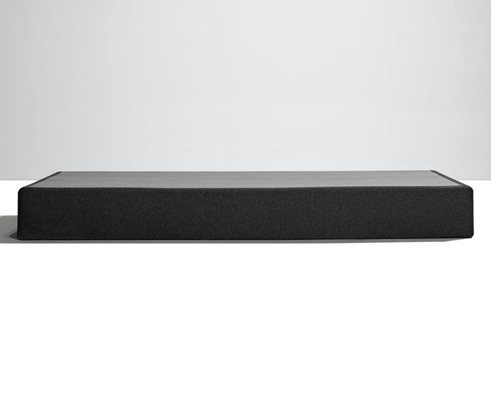 A rectangular black TEMPUR-FLAT™ High Profile Foundation in queen size is shown against a plain white and gray background, photographed from the front. This foundation provides sturdy mattress support while maintaining a sleek, modern appearance.