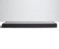A low, rectangular TEMPUR-FLAT™ Low Profile Foundation with a dark finish is set against a plain white background, providing sturdy support for your TEMPUR-Pedic mattress.
