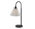 Featuring a sleek black finish, the Thalia Table Lamp is designed with a round base, curved arm, and a white pleated lampshade. Photographed on a plain white background, this modern accent lamp brings style and sophistication to any space.