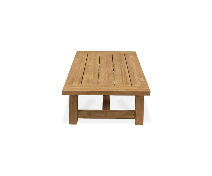 The Thorvid Outdoor Coffee Table features a rectangular design crafted from solid teak, with a slatted top and sturdy legs. Shown from the end against a plain white background, this weather-resistant table is ideal for any patio or garden setting.