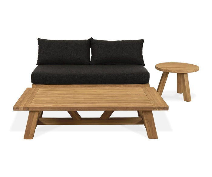 Arranged together to create a weather-resistant and stylish seating area, the Thorvid Outdoor Coffee Table, a small round outdoor side table, and a two-seater sofa with black cushions offer both functionality and elegance.
