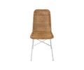 The Tori Dining Chair, shown in natural wicker with a woven seat and backrest and slim white metal legs, features a simple modern design and is set against a plain white background.