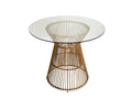 The Tori Round Counter Table features a round, transparent glass top that showcases its Scandinavian-inspired design. Its base consists of vertical rods in a flared, open arrangement with a natural wicker finish, creating a clean and timeless look.