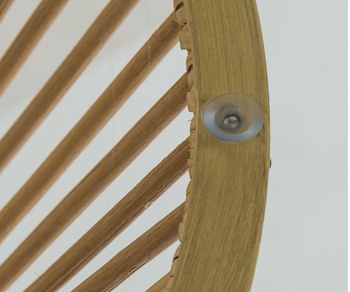 Close-up of the Tori Round Counter Table featuring a wooden circular frame with evenly spaced wooden spokes and a small clear suction cup attached to the edge, evoking a touch of Scandinavian style, against a plain white background.