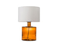 The Translucent Glass Lamp - Amber features a cylindrical amber recycled glass base and a plain white fabric shade, set against a white background.