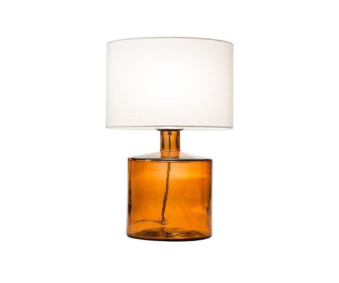 Translucent Glass Lamp - Amber features a cylindrical amber glass base paired with a large white fabric drum shade, displayed against a plain white background.