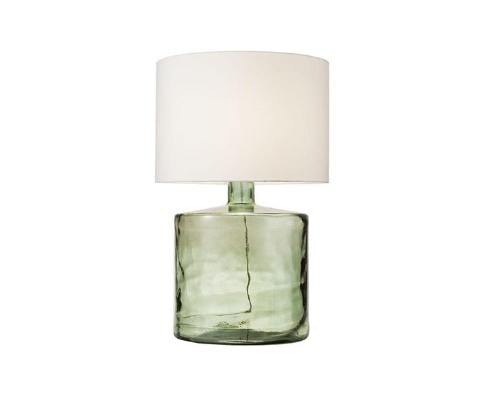 A Translucent Glass Lamp - Smokey Grey featuring a cylindrical, transparent smokey grey recycled glass base and a large white fabric shade, set against a plain white background.