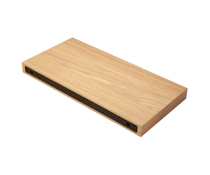 The Ulin 24″ Shelf is a rectangular, light wood floating shelf with a hollow underside, shown against a white background.