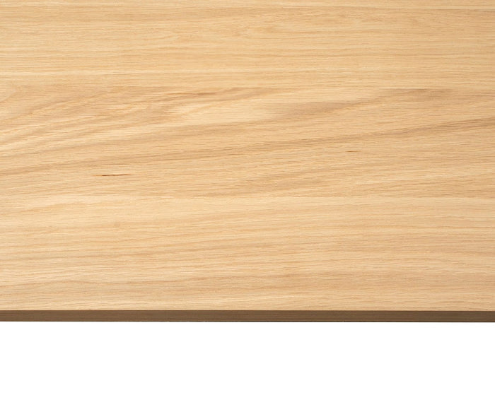 A close-up view of the Ulin 48″ Shelf showcases its light-colored wooden surface with a natural grain pattern and smooth finish, making it an ideal choice for crafting a modern floating shelf that seamlessly complements any contemporary wall shelf arrangement.