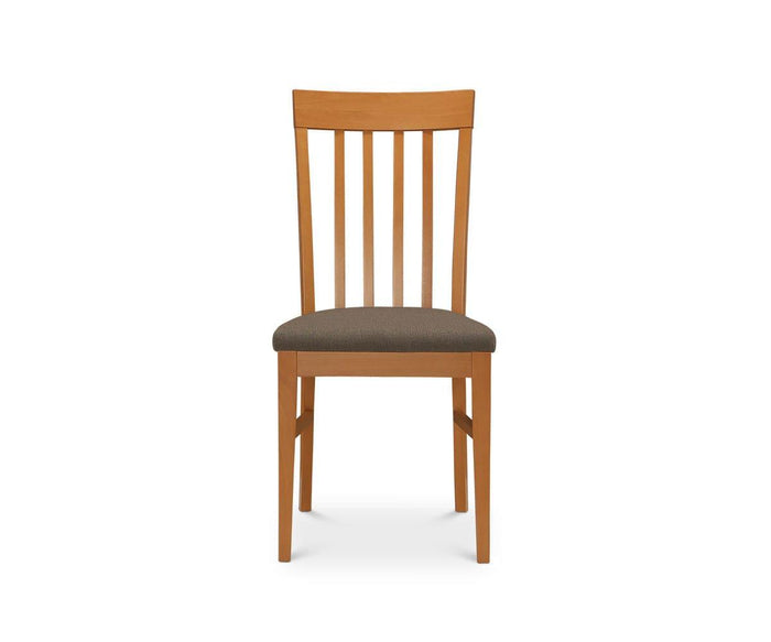 The Vackra Dining Chair, shown from the front against a white background, is a modern dining chair crafted from solid beech wood in a cherry finish, featuring a cushioned seat and vertical slats on the backrest.