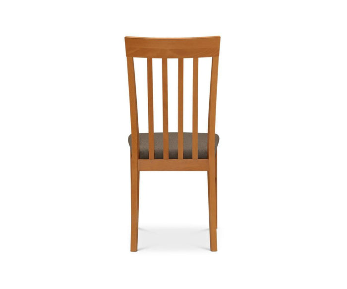 The Vackra Dining Chair, crafted from solid beech wood, is shown from the back against a plain white background. It features a dark cushioned seat, a tall straight backrest with five vertical slats, and simple straight legs.