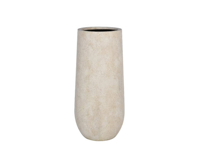 The Valentina Planter is a tall, cylindrical fiberstone piece in beige, featuring a slightly rounded base and a smooth, matte finish. Set against a white background, this frost-resistant planter offers modern elegance and durability for both indoor and outdoor spaces.