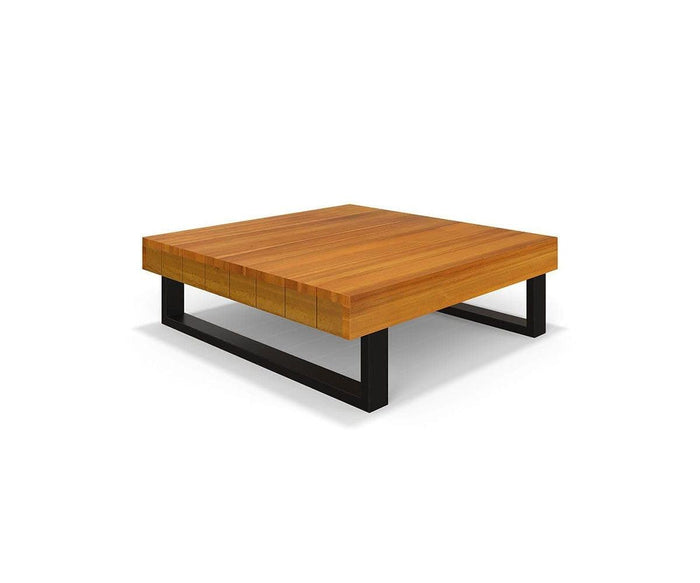 The Vila Outdoor Square Coffee Table features a modern square design with a thick acacia wood top in a sleek teak finish and sturdy black metal legs, showcased against a plain white background.