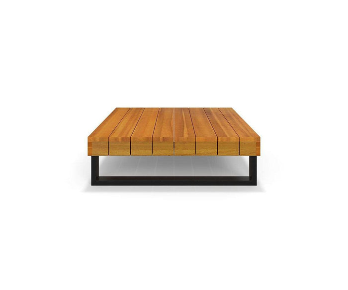 The Vila Outdoor Square Coffee Table features a modern design with an acacia wood slatted top in a warm teak finish and a black metal base, displayed against a plain white background.