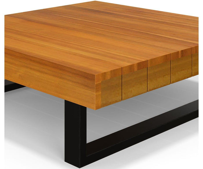 The Vila Outdoor Square Coffee Table features a thick, light brown acacia wood top and black metal legs in a minimalist, modern design. This square wooden coffee table is photographed against a white background.