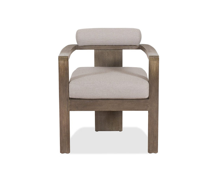 The Vinna Outdoor Dining Chair, shown here in Vinna Beige, features a modern wooden frame with a curved backrest and cushioned seat and back for exceptional style and comfort. Designed as weather-resistant outdoor furniture, it stands out beautifully against a white background.
