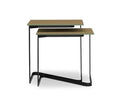 Two modern Vinstra Nesting Tables with slim black metal frames and rectangular latte tops are featured, one slightly smaller and neatly tucked under the other, set against a white background. The Vinstra Nesting Tables add a contemporary touch to any space with their sleek latte and black design and practical nesting functionality.