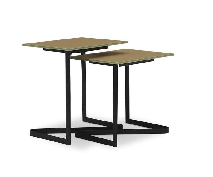 Two contemporary Vinstra Nesting Tables featuring square, light brown tempered glass tops and sleek black metal frames are arranged together against a white background, creating a crisp, modern look.