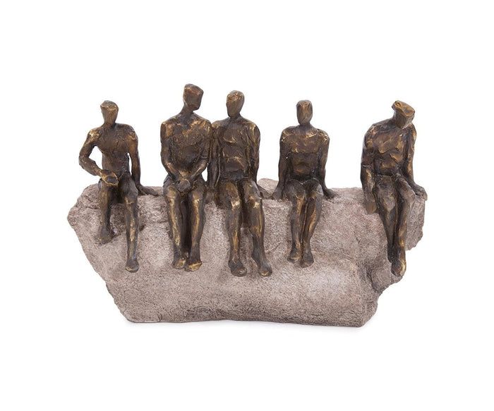 The Waiting Figure Statue features five abstract bronze human forms seated on a textured, stone-like bench. Each figure is crafted with minimal facial and body details and is adorned with a refined bronze finish that enhances their modern, artistic appeal.