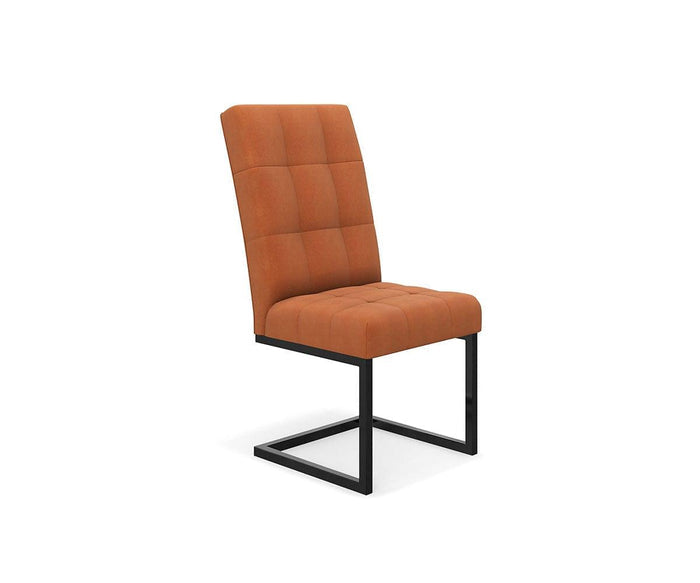 The West Dining Chair features a modern cantilever design with an orange cushioned seat and backrest, highlighted by a square tufted pattern and supported by black metal cantilever legs, set against a plain white background.
