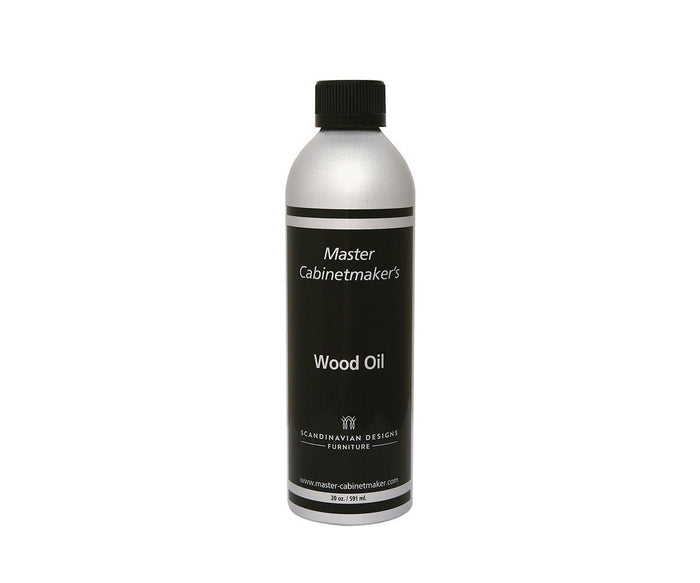 A silver bottle labeled Wood Oil with a black cap and black label, used for finishing and protecting hardwood furniture as part of regular furniture maintenance.